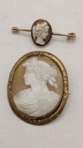 Two shell camo brooches in yellow metal mounts, both depicting maidens, 13.3g Location:
