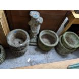 A selection of weathered garden concrete pots to include a pair of circular pots, and a group of