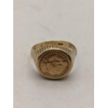 A 9ct gold signet ring set with an Austrian coin, 5.6g Location: