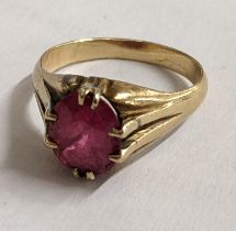 A yellow metal and ruby ring in a claw setting, 4.1g Location: