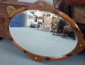 An Arts & Crafts oak framed oval wall mirror Location: RWB