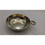 A late 20th century silver tastevin with snake form ring handle, hallmarked Birmingham 1978, 73.5g