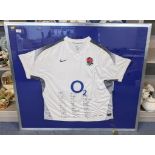 A 2011 World Cup England rugby shirt with signatures of the full team, in a silver coloured frame,