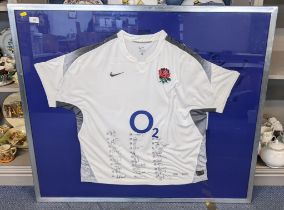 A 2011 World Cup England rugby shirt with signatures of the full team, in a silver coloured frame,