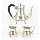 A Continental white metal three piece tea set, early 20th century, comprising a teapot, sugar pot