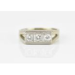 An 18ct white gold and three stone diamond dress ring