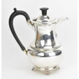 A George V silver hot water pot by A. L. Davenport Ltd, Birmingham 1934, of baluster form with