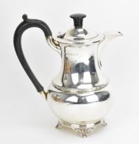 A George V silver hot water pot by A. L. Davenport Ltd, Birmingham 1934, of baluster form with