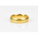 A 22ct yellow gold gentleman's wedding band, size P, weight 9.3 grams
