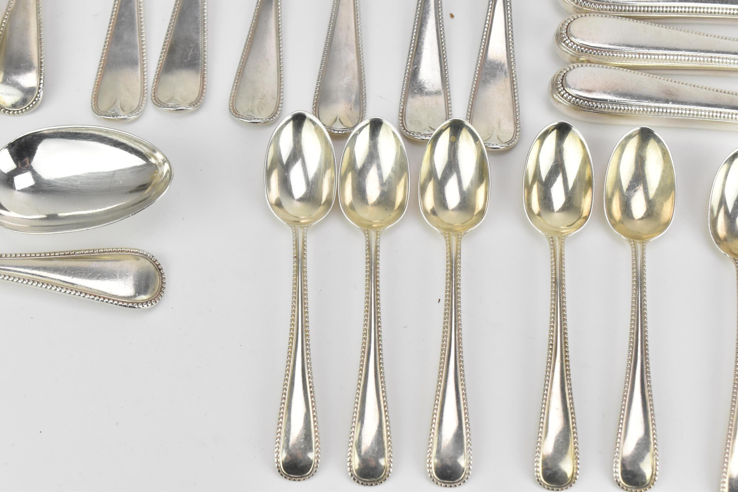 A George III and later matched flatware service, in the Old English and bead pattern, six setting, - Image 4 of 10