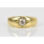 An 18ct yellow gold and diamond gypsy ring, with central old European cut diamond, hallmarked to