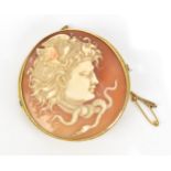A yellow metal mounted Classical cameo shell brooch of Hermes, of circular form, the mount with