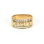 A 9ct yellow gold and diamond dress ring, set with a central row of five bezel set princess cut