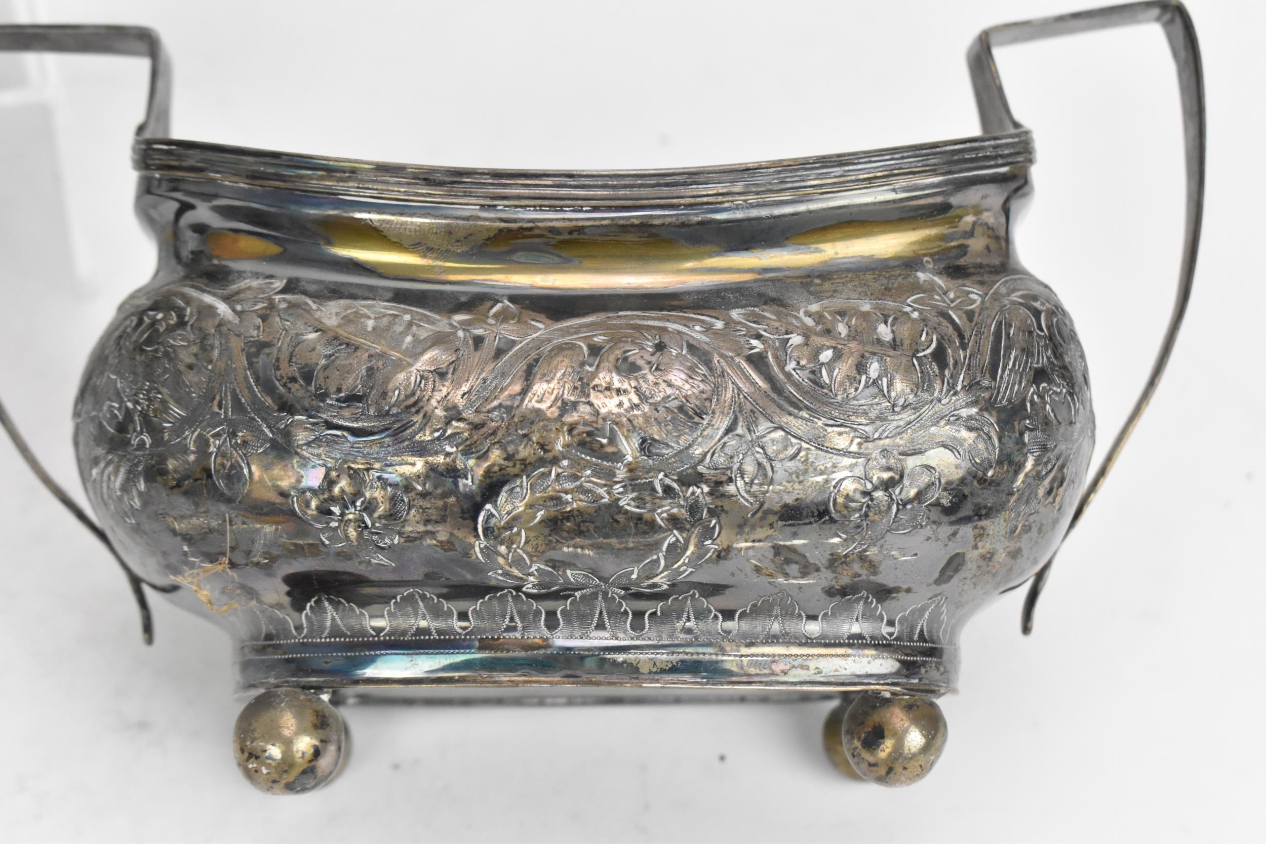 A George III silver three piece tea set, with rubbed hallmarks, comprising a teapot, twin-handled - Image 4 of 8