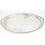 A large George V silver serving tray by Elkington & Co Ltd, Birmingham 1918, of oval form with