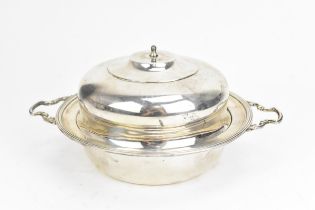 A George V silver muffin dish by Edward & Sons, Birmingham 1935, of circular form with moulded rim