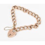 A 9ct rose gold curb link bracelet, with heart shaped padlock and safety chain, weight 12.5 grams