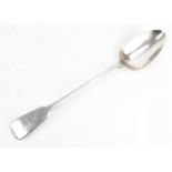 A George IV silver basting spoon by William Eaton, London 1824, in the fiddle pattern, 30 cm long,