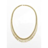An Italian 9ct yellow gold fringe necklace, the brick links with hanging graduated fringe, closing