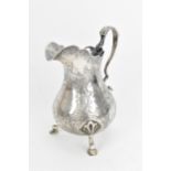 An early Victorian silver milk jug by Thomas Hughes Headland, London 1843, of baluster design with