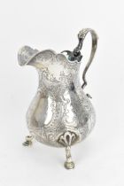 An early Victorian silver milk jug by Thomas Hughes Headland, London 1843, of baluster design with