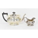 An Edward VII silver teapot and milk jug by William Adams Ltd, Birmingham 1909, the teapot with