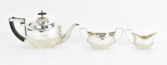 A Victorian silver three piece bachelor's tea set by Lines, Bunn & Mason, Birmingham 1897,
