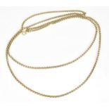 A yellow metal double chain necklace, with faceted rolo links, 65 cm long, weight 36 grams