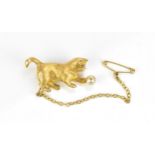 An 18ct yellow gold, diamond and pearl brooch of a cat playing with a ball, naturalistically