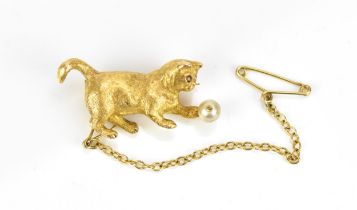 An 18ct yellow gold, diamond and pearl brooch of a cat playing with a ball, naturalistically