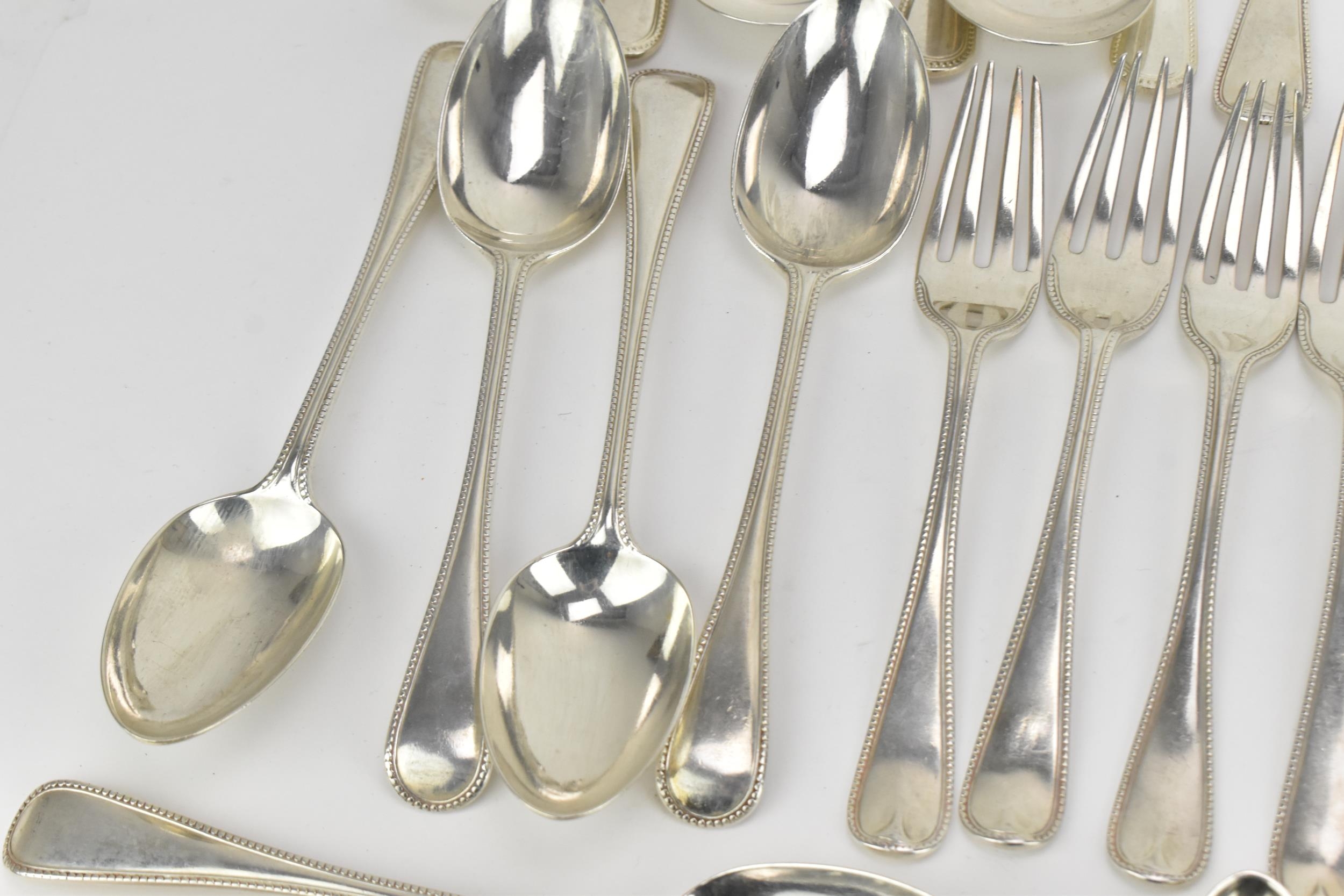 A George III and later matched flatware service, in the Old English and bead pattern, six setting, - Image 3 of 10