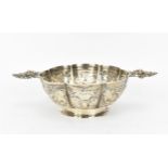 A Dutch export silver twin handled footed bowl, late 19th century, with lobbed body decorated with