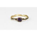 A George III yellow metal, enamel and amethyst mourning ring, the scrolling band inscribed 'John.