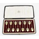 A cased set of George V silver-gilt coffee spoons by Manoah Rhodes & Sons, London 1930, each with