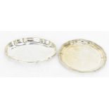 Two Egyptian silver card trays, post 1940, one of oval form, the other of lobbed form with beaded