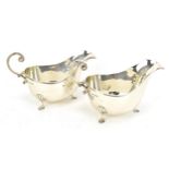 A pair of Elizabeth II silver sauce boats by Walker & Hall, Sheffield 1963, with moulded rim, c-