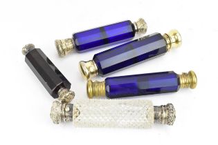 A Victorian double ended cut glass scent bottle, the white metal caps set with a turquoise beaded