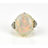 An Art Deco 18ct yellow gold, diamond and opal dress ring, with large central white/fire opal