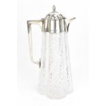 An Edwardian silver claret jug by John Grinsell & Sons, Birmingham 1907, of quatrefoil shape with