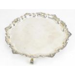 An Elizabeth II silver salver by Adie Brothers Ltd, Birmingham 1960, with shell and scroll moulded