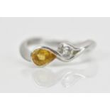 An 18ct white gold, diamond and citrine ring, set with a brilliant cut diamond approx 0.14ct, and