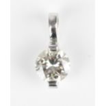 A white metal mounted solitaire diamond pendant, the brilliant cut stone approx 0.5 ct, in two