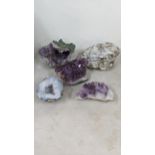Three large purple amethyst clusters, approx 12cm H x 18cm W, 9.5cm H x 18cm W, 7cm H x17cm W