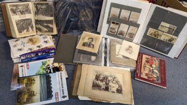 A selection of mainly military related ephemera to include a scrap album, photograph albums and