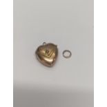 A 9ct gold heart shaped pendant locket, inset with sea of pearl A/F Location: CAB4