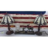 A pair of Tiffany style lamps and an Art Deco inspired lamp mounted with two stags Location