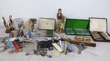 A mixed lot to include a camel bone trinket box boxed and loose collectors spoons, trench art silver