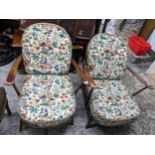 Two Ercol fleur-de-Lys open armchairs with tapestry printed style loose seat and back cushions