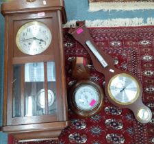 A Westminster chime wall clock with key in oak case together with a circular oak cased wall
