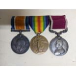 A WWI long service and good conduct three-medal campaign group with ribbons on bar named to M-